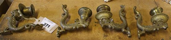 A set of four bronze dolphin wall appliques, 12cm
